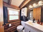 Upper level full bathroom complete with shower tub combo that was newly installed for 2023